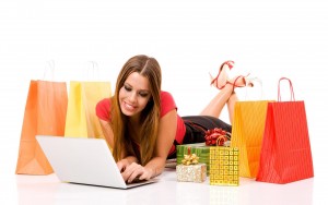 Beautiful young woman shopping over internet